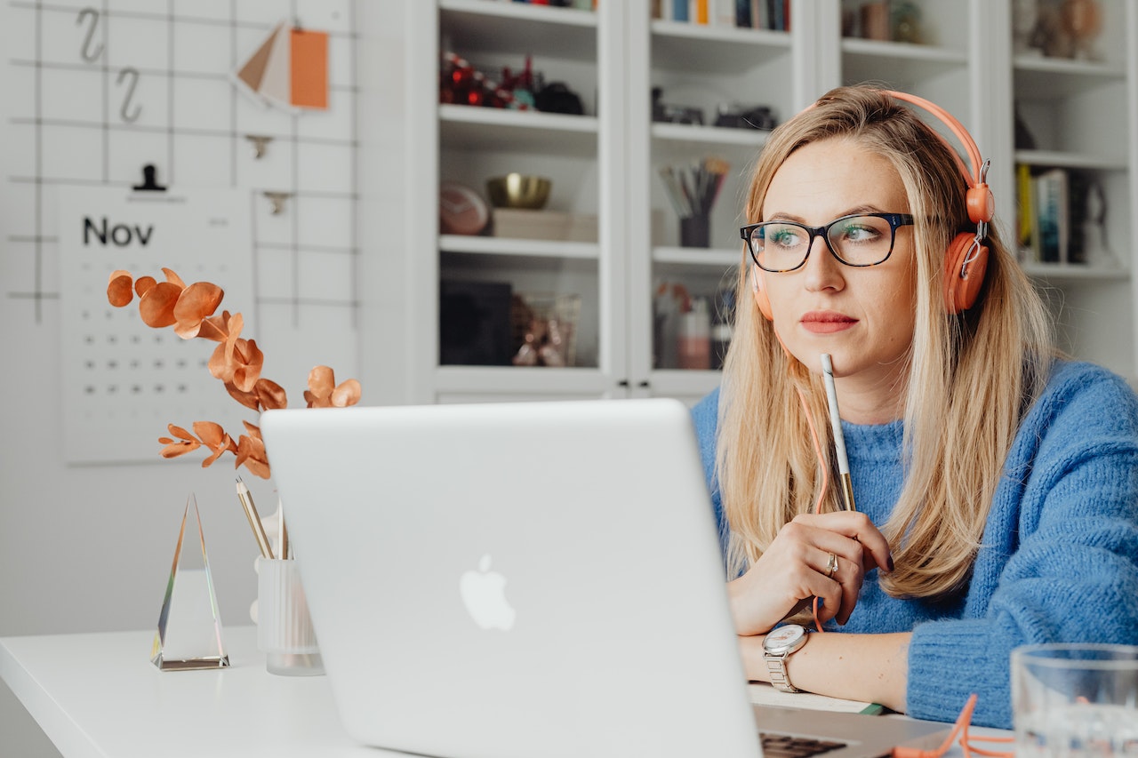 An image of a writer thinking at her desk