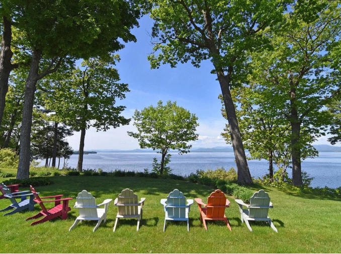 Leisure chairs in backyard looking over lake